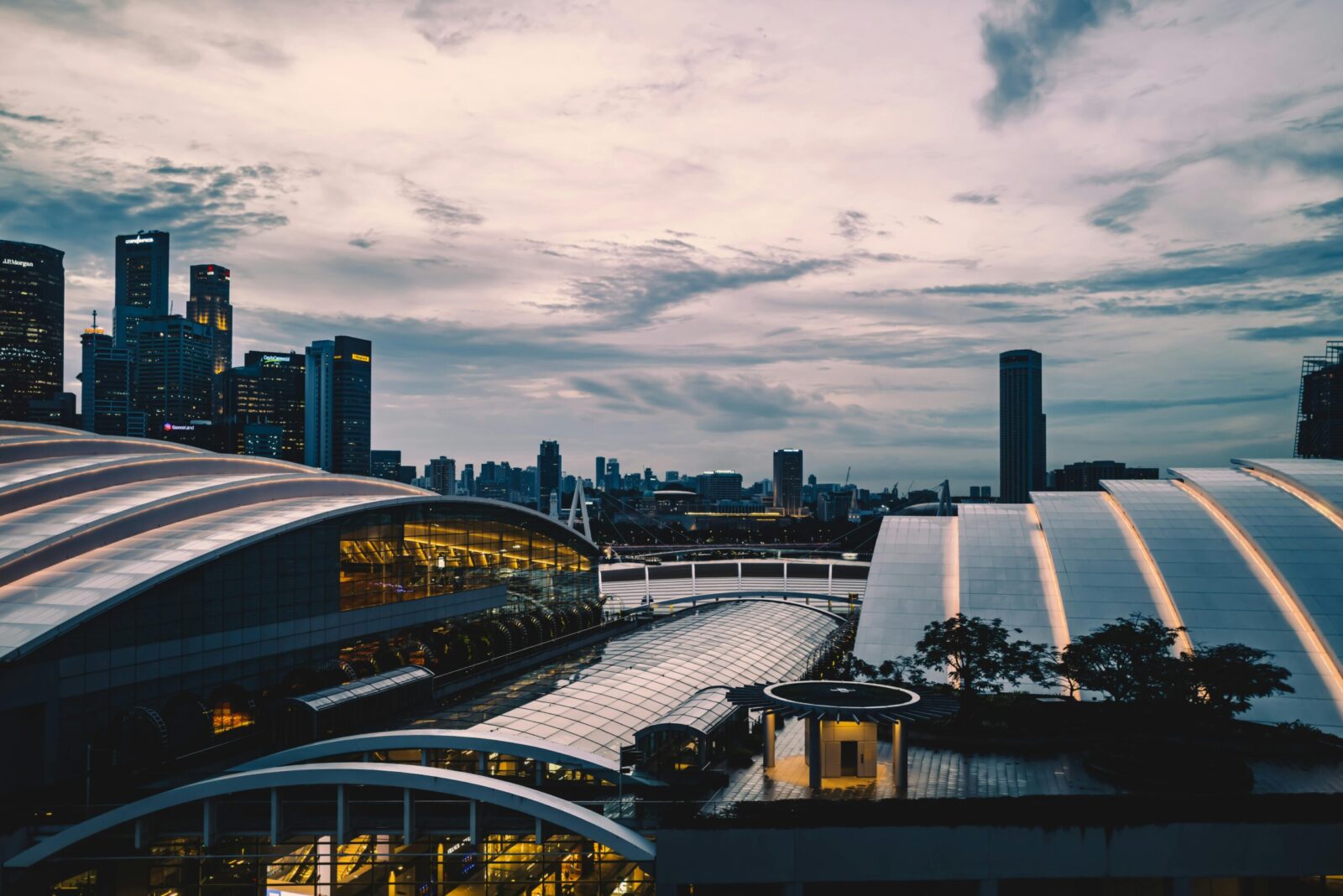Scenic Singapore city skyline at dusk featuring modern skyscrapers and urban architecture.